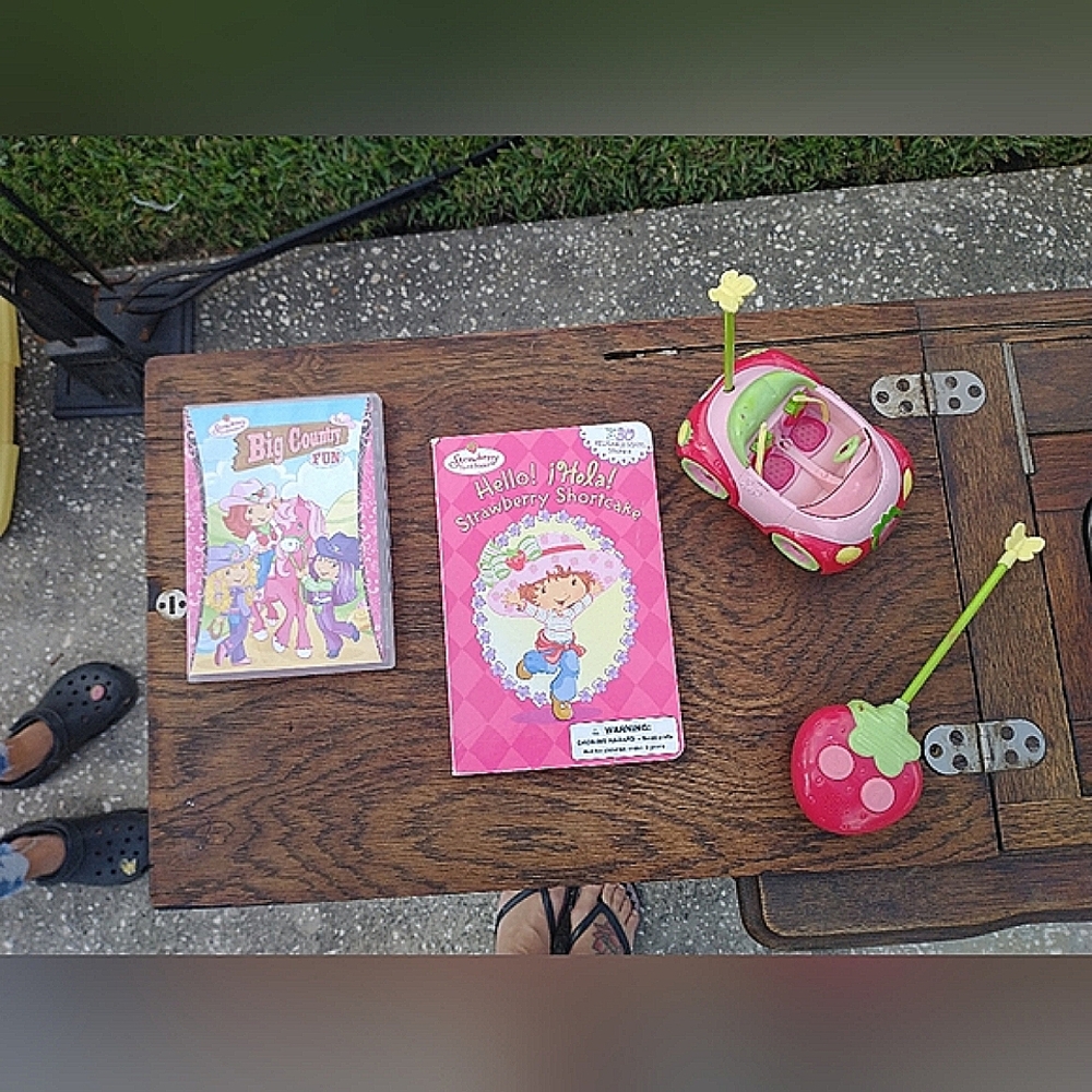 Strawberry Shortcake RC car with remote control, DVD, book, and doll